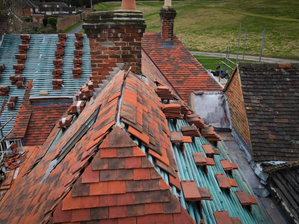 Replacing Broken Roof Tiles On Old House